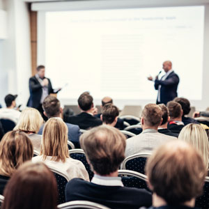 people speaking at a conference